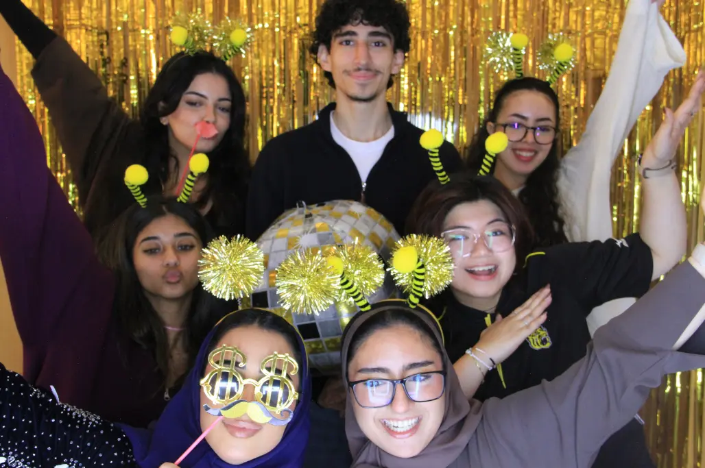 Corporate team enjoying a PartyBooth photobooth at a Dubai event